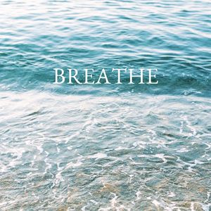 Profile view of a man breathing deeply before a set.